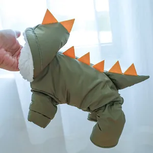 Detail of green dinosaur pet hoodie with orange spikes and warm white fleece lining