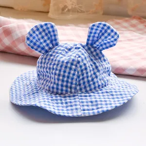 Close-up of blue gingham pet sun hat with cute 3D ears and breathable cotton fabric