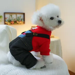 Detail of dog hoodie and denim overalls featuring a back D-ring for leash attachment