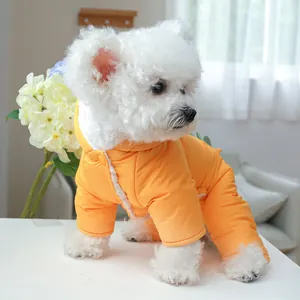 Detail of yellow pet dog jumpsuit with white fleece lining and snap buttons