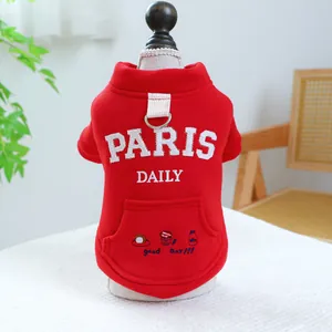 Detail of red warm pet hoodie with Paris Daily embroidery and integrated metal D-ring