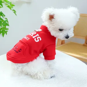 Detail of red pet hoodie with white RIS embroidery and metal D-ring for small dogs