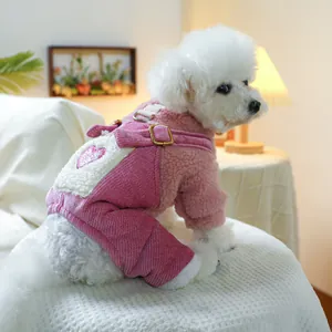 Detail of pink winter dog jumpsuit with heart patch and metal D-ring for traction