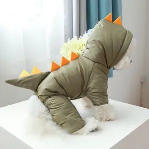 Close-up of the dinosaur fin and tail details on a thick green winter pet jacket