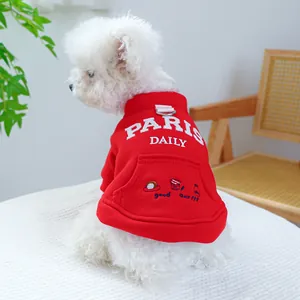 Detail of red pet hoodie with white PARIS DAILY embroidery and metal D-ring for leash attachment