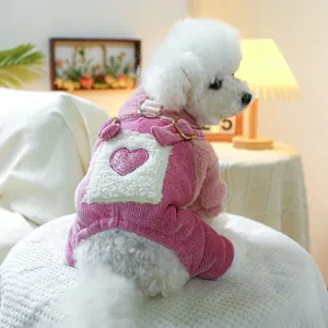 Detail of pink fleece dog sweater with heart embroidery and metallic leash D-ring
