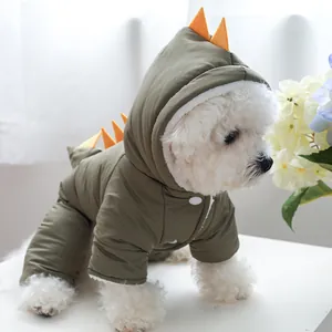 Detail of dinosaur-shaped pet winter coat with green fabric and orange back fins