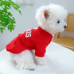 Detail of red dog hoodie featuring white PARIS embroidery and a small back pocket