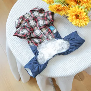 Detail of warm plaid pet jacket with soft fleece lining and denim trim for small dogs