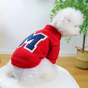 Warm red pet hoodie for dogs featuring a blue letter M embroidery and ribbed cuffs