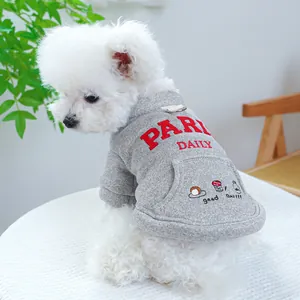 Detail of grey pet sweatshirt with red PARIS embroidery and metal D-ring for leash