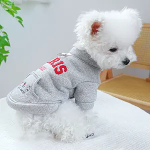 Detail of grey pet hoodie featuring red Paris embroidery and functional metal D-ring for leash