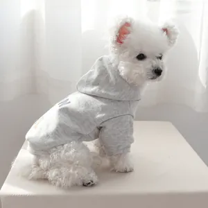 Detail of light gray pet hoodie featuring colorful letter print and ribbed cuffs