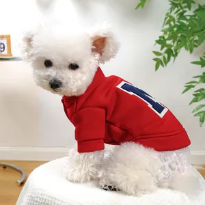 Detail of red pet hoodie with blue letter M print and ribbed cuffs for small dogs