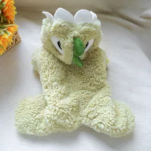 Detail view of soft light green dinosaur pet hoodie showing fluffy fleece texture and cute scales