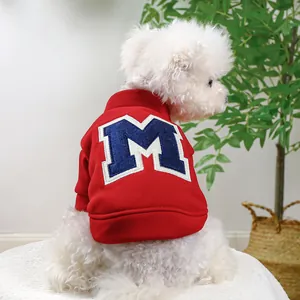 Detailed close-up of the red pet hoodie featuring a blue embroidered letter M on the back