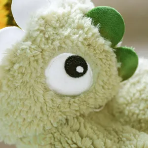 Detail of soft fleece pet clothes with high-quality embroidery of a dinosaur eye