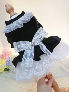 Detail of velvet pet dress with white lace bow and sparkling rhinestone centerpiece