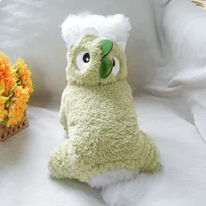 Detail of soft green dinosaur plush pet costume with cute embroidery and fleece texture