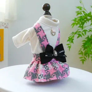 Houndstooth pet dress with bow, D-ring attachment, and knit base layer for dogs and cats