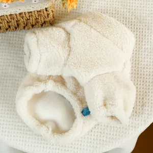 Warm white sherpa fleece pet vest with blue brand label for dogs and cats in autumn winter