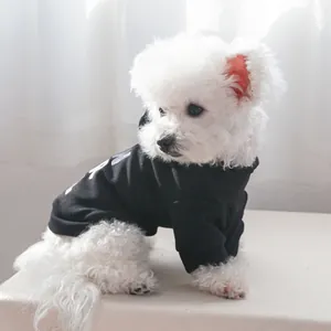 Detail of black pet hoodie with white lettering on soft cotton fabric for small dogs