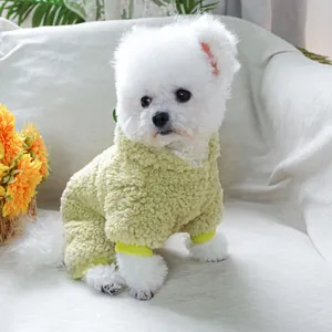 Close-up of a warm green fleece pet hoodie for small dogs with yellow ribbed cuffs and hem