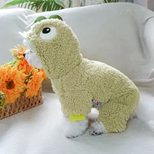 Detail of plush green dinosaur dog coat showing warm fleece texture and hood design