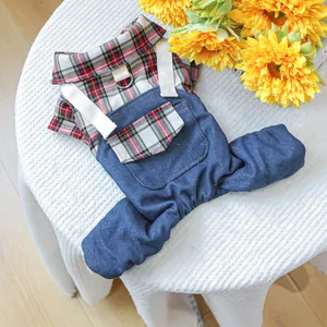 Detail of pet plaid shirt with denim pants featuring a sturdy metal D-ring for a leash