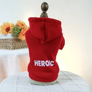 Detailed view of a red hooded pet sweatshirt with white HEROIC lettering for small dogs
