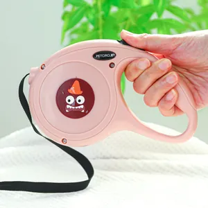 Laisse rétractable rose pour chien avec motif monstre et poignée ergonomique confortable