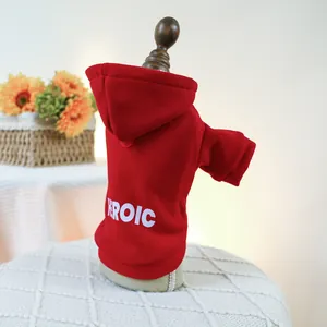 Close-up of a red pet hoodie with white HEROIC print on comfortable cotton fabric