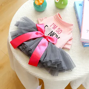 Pink dog dress with 'I'M SO FANCY' embroidery and tiered grey tulle skirt and red bow