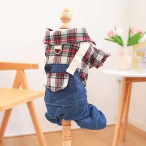 Detail of British plaid shirt and denim overalls on wooden model for small dogs