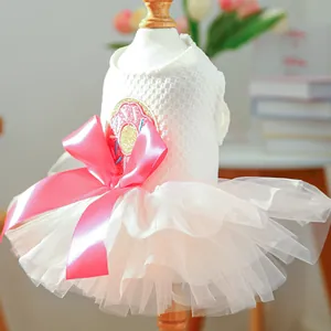 Detail of pet dress with pink tulle skirt, waffle knit top and large satin bow decoration