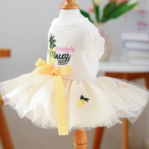 Detail of pineapple embroidery and layered mesh skirt on pet princess dress
