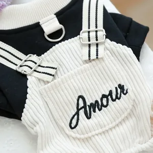 Detail of pet hoodie with corduroy overalls, metal D-ring and Amour embroidery