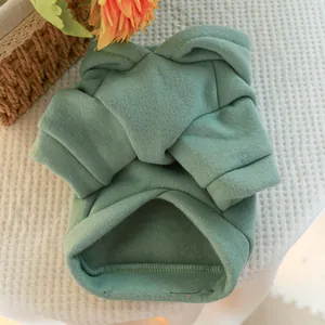 Detail of pea green pet hoodie showing thick fleece fabric and ribbed cuffs and hem