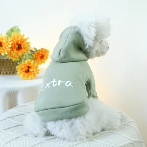 Detail of green pet hoodie with Extra lettering on soft knit fleece fabric for small dogs