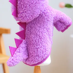 Detail of purple dinosaur pet hoodie with soft fleece texture and pink back spikes