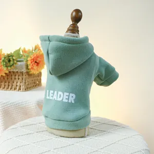 Close-up of green pet hoodie with LEADER print on fleece fabric for small dogs