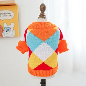 Detail view of colorful argyle knit sweater for pets with ribbed cuffs and soft texture