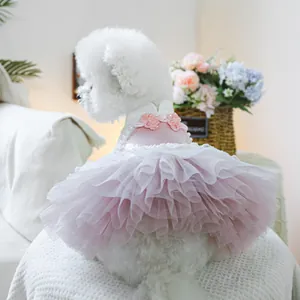 Close-up of pink pet tutu dress with sequin bodice and handmade floral embellishments