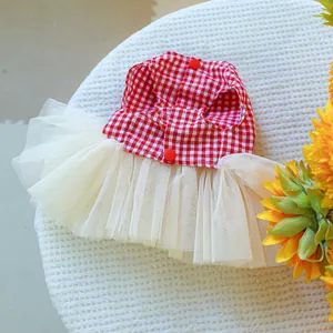 Close-up of red plaid cotton top and layered beige tulle skirt on a pet summer dress