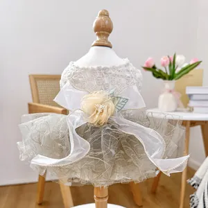 Close-up of elegant pet dress featuring lace floral bodice and layered tulle skirt