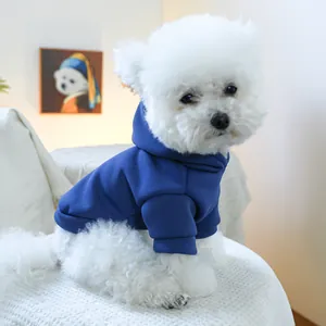 Detail of navy blue hooded pet sweatshirt with soft fleece lining on a white dog