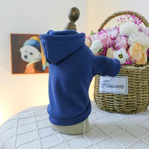 Close-up of a dark blue pet hoodie featuring thick fabric and warm fleece lining detail