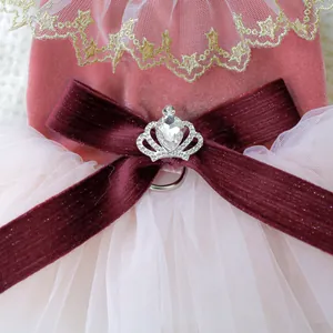 Macro detail of pet wedding dress with crown rhinestone brooch and velvet bow