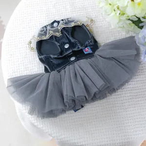 Macro view of luxurious dark grey velvet dog dress with golden lace and layered tulle skirt