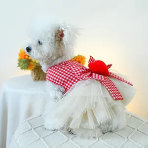 Detail of red and white checkered pet dress with heart pattern and puffy tulle skirt